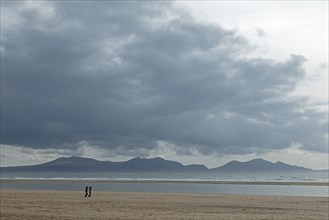 Beach, people, clouds, mountains, LLanddwyn Bay, Newborough, Isle of Anglesey, Wales, Great Britain