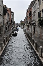 Canal Fondamenta Soranzo delle Fornaci, A canal in Venice with docked boats and historic buildings,