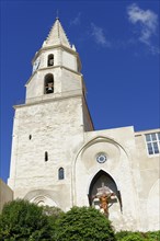Old church tower with a cross, in front of a clear blue sky, Marseille, Bouches-du-Rhone