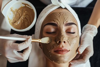 Cosmetician applying brown beauty skin care face mask on woman's face. KI generiert, generiert, AI