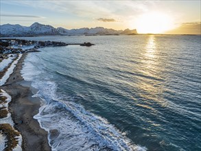 Aerial view of beach and sea at sunset, sea spray, coast, mountains, Senja, Troms, Norway, Europe