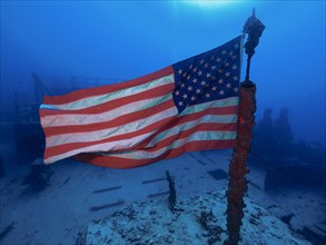 US flag waving in the current on the wreck of the USS Spiegel Grove, dive site John Pennekamp Coral