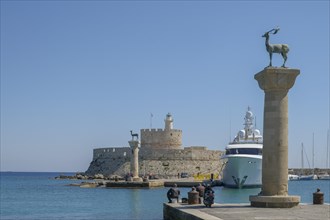 Elafos and Elafina, stag and hind, sculptures on columns, harbour entrance Mandraki harbour,