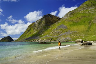 Landscape with sea at the sandy beach of Haukland (Hauklandstranda) with the mountain Veggen. A
