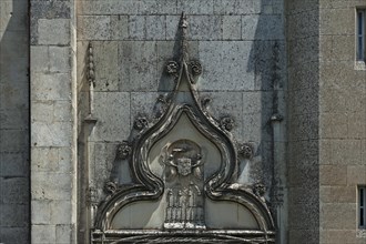 Ornament above the side entrance of Notre Dame de l'Assomption Cathedral, Lucon, Vendee, France,