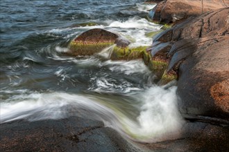Red granite, rocky coast, surf, long exposure, Havsvidden, Geta, Aland, Aland Islands, Finland,