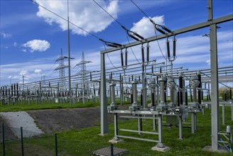 Power pylons with high-voltage lines and insulators at the Avacon substation in Helmstedt,