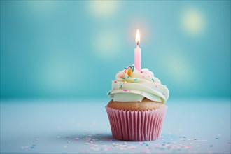 Single birthday cupcake with candle on blue background. KI generiert, generiert, AI generated