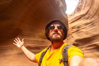 Selfie of a tourist enjoying in the limestone canyon Barranco de las Vacas in Gran Canaria, Canary