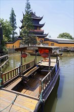 Excursion to Zhujiajiao water village, Shanghai, China, Asia, Wooden boat on canal with view of