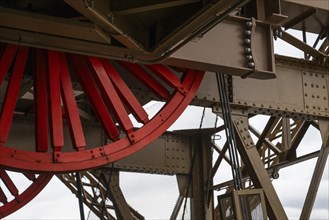 Eiffel Tower, red drive wheel for lift, close-up, Paris, Ile-de-France, France, Europe