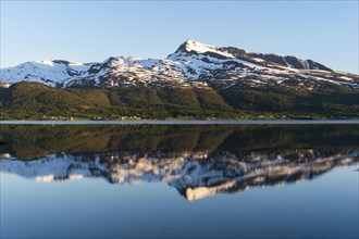 Landscape in Norway. The Balsfjord with a view of Mount Fugltinden. At night during the midnight