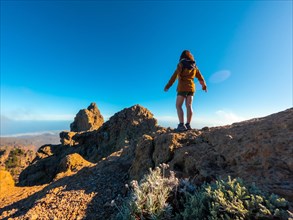 A woman tourist on the top of Pico de las Nieves in Gran Canaria, Canary Islands