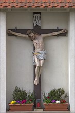 Christ's Cross in the churchyard of St Oswald's Church, Baunach, Upper Franconia, Bavaria, Germany,