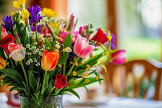 Mother's Day, A magnificent bouquet of multi-coloured spring flowers in a green vase, AI generated,