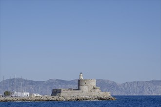 Agios Nikolaos Fortress with Lighthouse, Mandraki Harbour, Rhodes Town, Rhodes, Greece, Europe