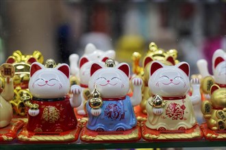 Strolling through the restored Tianzifang neighbourhood, A collection of golden waving cats, which