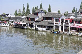 Excursion to Zhujiajiao water village, Shanghai, China, Asia, Wooden boat on canal with views of