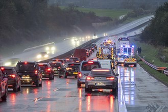 Traffic jam after an accident on the A5 motorway on a wet road, Nieder-Ohmen, Hesse, Germany,
