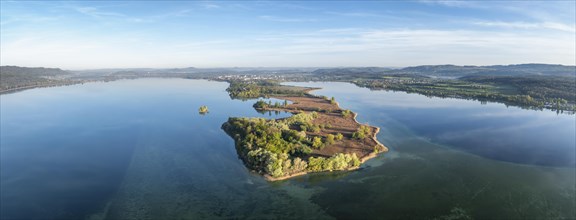 Aerial view, panorama of the Mettnau peninsula with spring-like vegetation, on the horizon the town