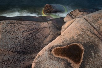 Red granite, rocky coast, surf, long exposure, Havsvidden, Geta, Aland, Aland Islands, Finland,