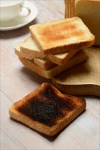 Burnt slice of toast with toast, toast