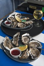 Fresh oysters with lemon on a tray, Atlantic coast, Vandee, France, Europe