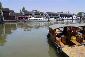 Excursion to Zhujiajiao water village, Shanghai, China, Asia, wooden boat on canal with views of