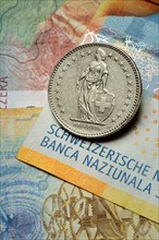 Swiss coin on banknotes, Swiss franc, Switzerland, Europe
