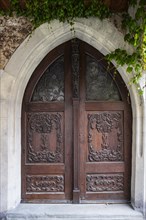 Richly decorated portal on the historic town hall from the 15th century in the old town centre of