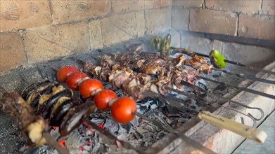 Barbeque on the grill in the restaurant. Roasted meat and vegetables