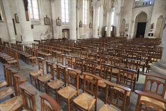 Empty seating in the interior of St Michael's in Saint Michel en l'Herm, Vandee, France, Europe