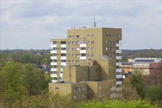Bird's eye view of a modern, monotonous residential building in spring, high-rise building,