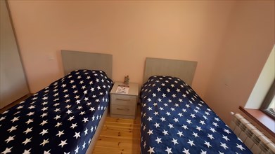 Interior of a hotel room with double bed in the American flag