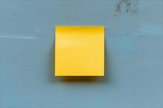 Yellow empty memo note pad stuck to blue wall. KI generiert, generiert, AI generated