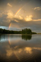 Rainbow over lake near Hartola, forest, evening mood, Finland, Europe