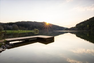 Lake at sunset. Beautiful landscape, taken from the shore of a reservoir. Situated in the middle of