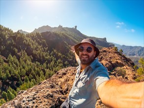 Selfie of a hiker at a Roque Nublo viewpoint in Gran Canaria, Canary Islands