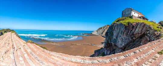 Panoramic view of Itzurun beach in the Flysch Basque Coast geopark in Zumaia, Gipuzkoa
