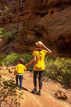 A woman with her child in the limestone canyon Barranco de las Vacas on Gran Canaria, Canary
