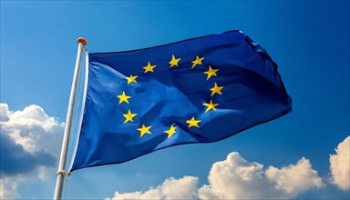 The flag of the EU flutters in the wind, isolated, against the blue sky