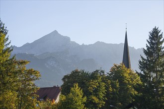 Old parish church of St Martin in the evening light, Wetterstein mountains with Alps, Partenkirchen