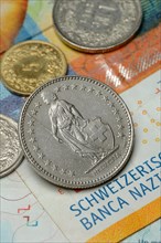 Swiss coins on banknotes, Swiss franc, Switzerland, Europe