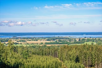 High angle view at a rural landscape with a lake in the horizon a sunny summer day, Hornborgasjon,