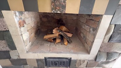 Fireplace in a country house. Firewood in the fireplace