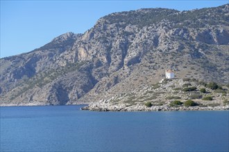Old windmill on a rock, Bay of Panormitis, Symi, Dodecanese, Greece, Europe