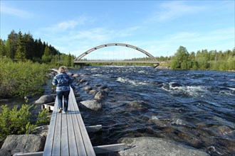 Footbridge on the rapids of the river Skelleftea, Lapland, Sweden, Scandinavia, Europe