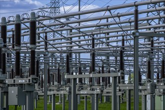 Power pylons with high-voltage lines and insulators at the Avacon substation in Helmstedt,