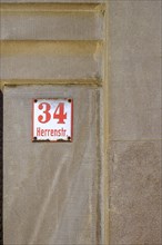 Herrenstrasse 34, historic house number sign in the old town centre of Wangen im Allgaeu,
