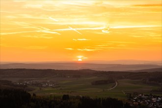 Panorama of a romantic landscape at sunset in the evening light. beautiful spring landscape in the